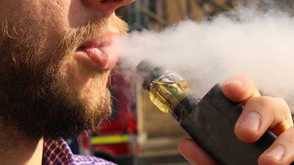 Person smoking an e-cigarette