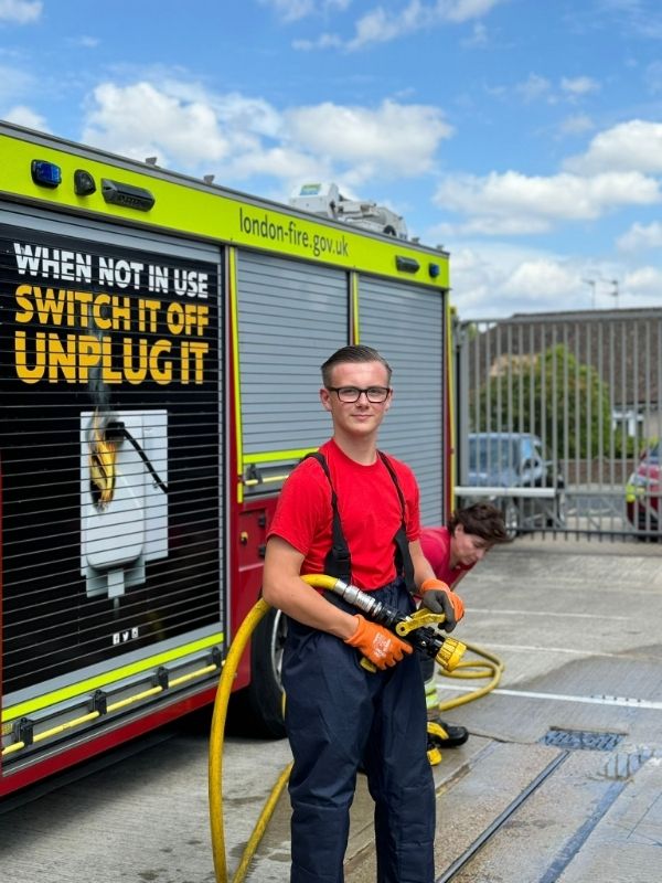 Fire Cadet holding a hose